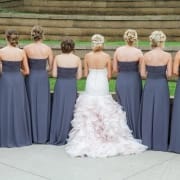 Bride wearing traditional ballgown wedding dress for ceremony before changing into reception dress
