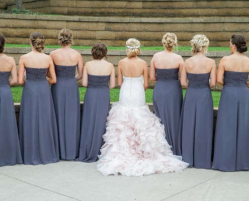 Bride wearing traditional ballgown wedding dress for ceremony before changing into reception dress