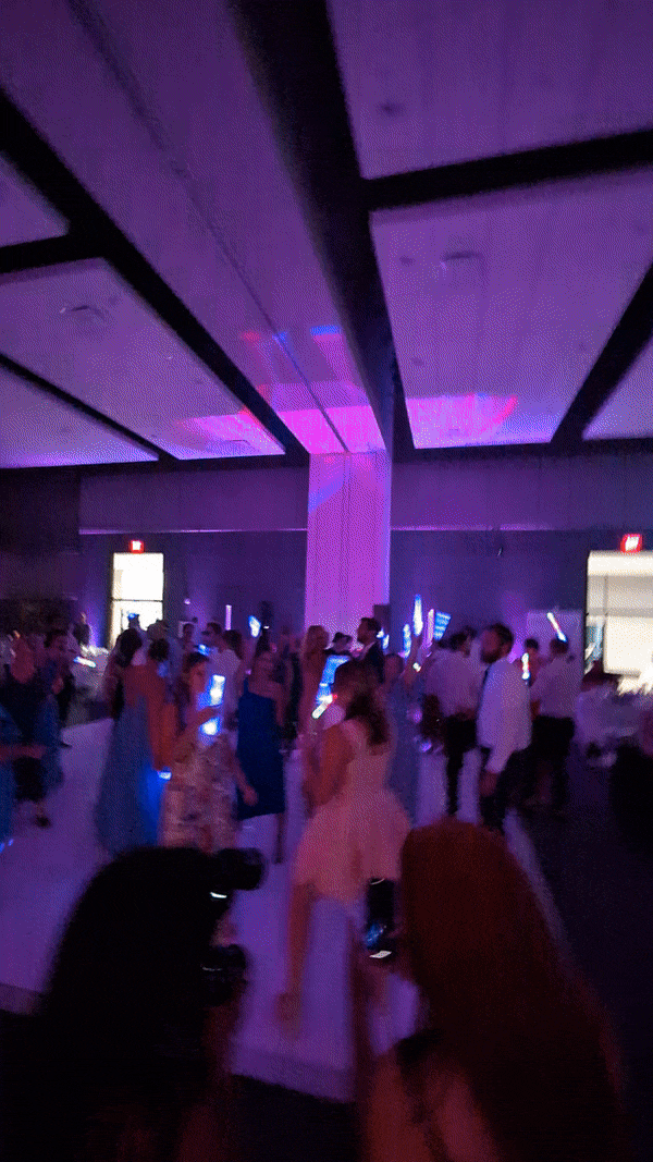 Newlyweds and guests enjoying a lively dance party by Posh Sound & Lighting's expert Canton wedding DJ team